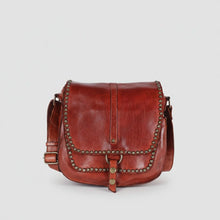 Load image into Gallery viewer, Front of cognac Walker River Italian leather saddle crossbody with star-studded flap and ring-and-snap strap