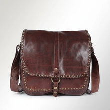 Load image into Gallery viewer, Front of dark brown Walker River Italian leather saddle crossbody with star-studded flap and ring-and-snap strap