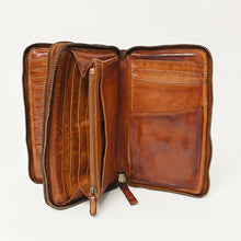 Load image into Gallery viewer, Cognac leather double zip wallet opened to show both compartments, zip coin pocket, bill sections, and card slots