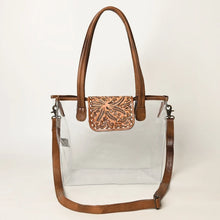 Load image into Gallery viewer, Acorn Ridge clear tote front view with hand tooled oak and acorn flap, rolled leather handles and crossbody strap
