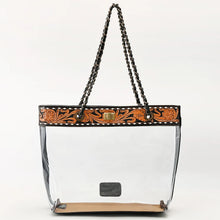 Load image into Gallery viewer, Midnight Bloom clear PVC tote with hand tooled floral leather band, brass twist lock and chain handles
