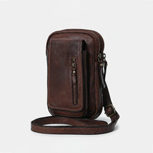 Load image into Gallery viewer, Angled view of dark brown Italian leather phone crossbody with adjustable leather strap