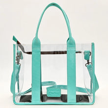 Load image into Gallery viewer, Turquoise Trail clear tote back view with turquoise leather handles, trim and zip top