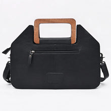 Load image into Gallery viewer, Back of the Moonflower purse in smooth black leather with exterior zip pocket and wooden handle