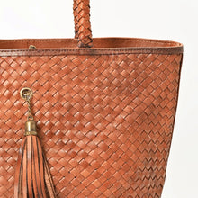 Load image into Gallery viewer, Close-up of Saffron hand-woven leather, braided handle and antique brass tassel cap