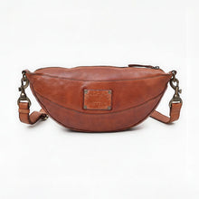 Load image into Gallery viewer, Back view of the Comet cognac leather crescent sling bag with detachable strap