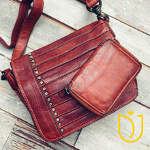 Load image into Gallery viewer, Washoe Lake studded Italian leather crossbody purse styled flat lay with the matching Penny zip-around leather wallet