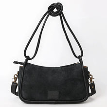 Load image into Gallery viewer, Back view of the Emilie black suede crossbody purse with knotted rolled leather handles and adjustable leather strap