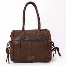 Load image into Gallery viewer, Back view of the Reata leather barrel satchel in Chocolate with exterior zip pocket and braided side seams