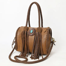 Load image into Gallery viewer, Reata turquoise braided fringe leather barrel satchel in Caramel, angled front view with brown fringe tassels and braided crossbody strap