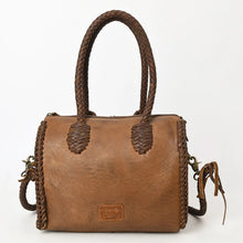 Load image into Gallery viewer, Back view of the Reata leather barrel satchel in Caramel with braided handles and braided side seams