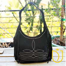 Load image into Gallery viewer, Onyx black suede fringe hobo bag, front view with cream boot-stitch embroidery and buck-stitch lacing