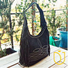Load image into Gallery viewer, Onyx black suede hobo bag, three-quarter view with diamond-stitched shoulder strap, boot stitching and side fringe