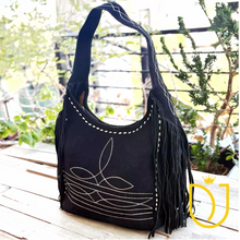 Load image into Gallery viewer, Onyx black suede fringe hobo bag, angled front view with boot-stitch pattern and diamond-stitched strap