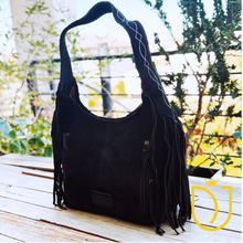 Load image into Gallery viewer, Onyx black suede hobo bag back, three-quarter view with stitched strap and cascading suede fringe