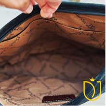 Load image into Gallery viewer, Inside the Onyx black suede hobo bag: printed fabric lining, interior slip pockets and zip-top closure