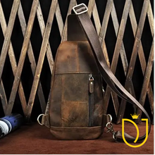 Load image into Gallery viewer, Back of the Drifter distressed leather sling bag showing paneled leather, vertical zip security pocket, D-rings, and swivel-clip strap