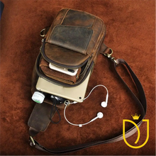 Load image into Gallery viewer, Drifter distressed leather sling bag packed with a phone, wallet, mini tablet, and earbuds threaded through the headphone port