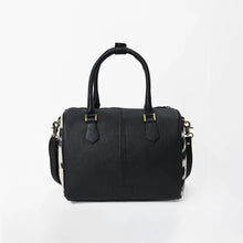 Load image into Gallery viewer, Tuff black and white hair-on cowhide speedy bag with PRCA patch and NFR charm