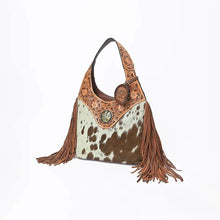 Load image into Gallery viewer, Appaloosa hair-on cowhide hobo bag with hand-tooled floral yoke, cactus concho and long leather fringe, three-quarter view