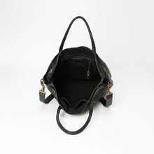 Load image into Gallery viewer, Inside the Emmylou black leather tote showing the zip-top opening, black lining, interior zip pocket, slip pockets and key clip
