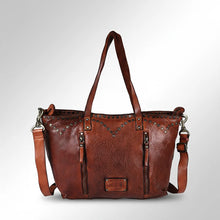 Load image into Gallery viewer, Emmylou studded Italian leather tote in cognac, front view with V-yoke studs, two vertical zip pockets and leather logo patch
