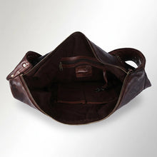 Load image into Gallery viewer, Inside the Emmylou cognac leather tote showing the zip-top opening, lining, interior zip pocket, slip pockets and key clip
