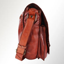 Load image into Gallery viewer, Side view of cognac leather saddle crossbody showing the strap buckle and gusset
