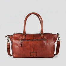 Load image into Gallery viewer, Back of the Rowan cognac leather satchel showing the exterior zip pocket, leather patch and detachable strap
