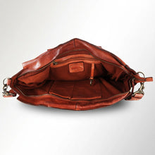 Load image into Gallery viewer, Inside the Rowan cognac leather satchel showing the zip-top opening, lining, interior zip pocket, slip pockets and key clip
