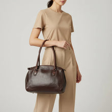 Load image into Gallery viewer, Model carrying the Marlowe dark brown Italian leather structured satchel tote over her arm
