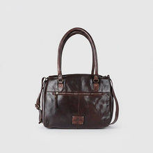 Load image into Gallery viewer, Back of the Marlowe dark brown Italian leather satchel tote with zip pocket, brand plate and crossbody strap
