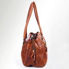 Load image into Gallery viewer, Side of the Marlowe cognac leather satchel tote showing side zip pocket and rolled handles
