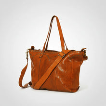 Load image into Gallery viewer, Emmylou studded Italian leather crossbody tote in honey tan, angled view showing V-yoke studs, handles and strap
