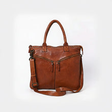 Load image into Gallery viewer, Front of the Vivienne cognac Italian leather tote with chevron zip pockets, star studs and crossbody strap
