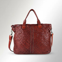 Load image into Gallery viewer, Front of the Penelope oxblood woven Italian leather tote with studded center stripe and crossbody strap
