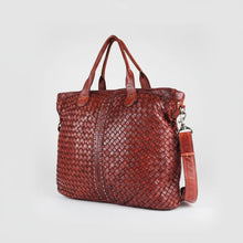 Load image into Gallery viewer, Penelope woven leather tote, angled view showing basketweave, studded stripe and crossbody strap
