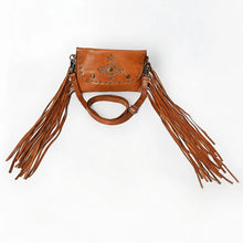 Load image into Gallery viewer, Front view of the Estrella tan leather crossbody with a studded star-and-cross medallion, studded flap border, and long leather fringe
