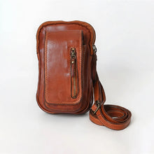 Load image into Gallery viewer, Front of cognac Lainey Italian leather phone crossbody with front pocket and vertical zip
