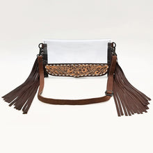 Load image into Gallery viewer, Two Step clear vinyl crossbody purse with hand tooled floral leather panel, white buckstitch and leather fringe
