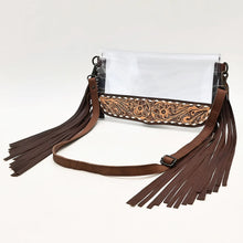 Load image into Gallery viewer, Two Step hand tooled leather fringe clear crossbody purse with adjustable leather strap, angled view
