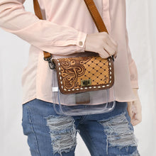 Load image into Gallery viewer, Trellis clear crossbody purse worn at the hip with quilted tooled leather flap and twist-lock closure

