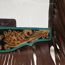 Load image into Gallery viewer, Close-up of the hand tooled floral panel with black background and turquoise leather edging on the Curtain Call purse
