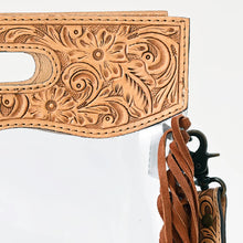 Load image into Gallery viewer, Close-up of the hand tooled floral carving and scalloped edge on the Cinch top panel, with swivel clip and fringe
