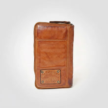 Load image into Gallery viewer, Back of cognac leather phone wallet with slip pocket and riveted stamped leather patch
