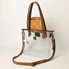 Load image into Gallery viewer, Acorn Ridge clear tote with tooled leather flap lifted to show the snap closure
