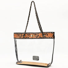 Load image into Gallery viewer, Midnight Bloom hand tooled leather clear tote with chain-and-leather handles, angled view
