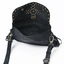 Load image into Gallery viewer, Estrella black leather crossbody open to show the suede-finish flap underside with its star stud pattern and the interior compartment
