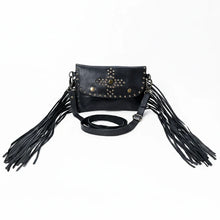 Load image into Gallery viewer, Front view of the Estrella black leather crossbody with a studded star-and-cross medallion, studded flap border, and long leather fringe
