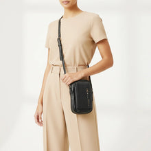 Load image into Gallery viewer, Woman wearing the black Lainey Italian leather phone crossbody
